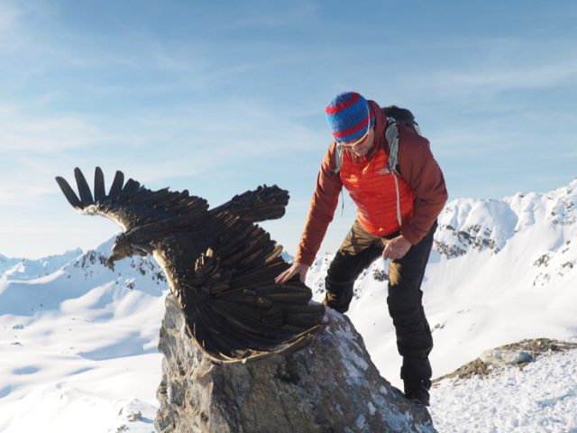 Artist Walter File with his sculpture in the Alps